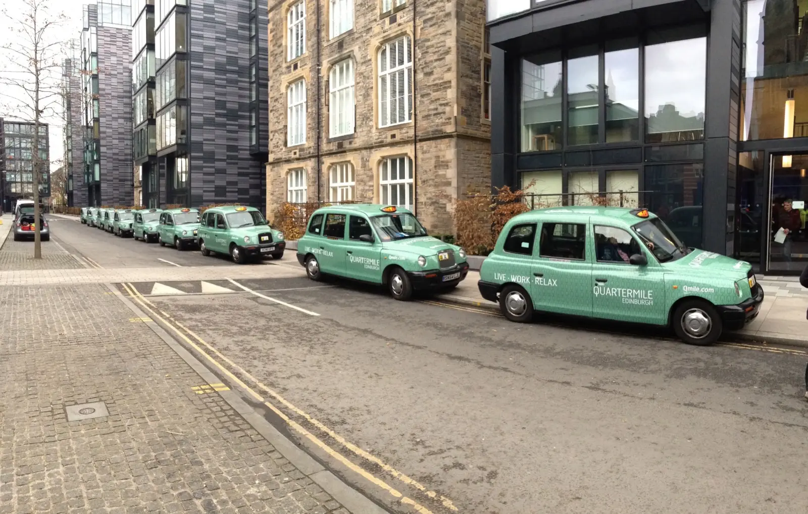 Fleet of taxis with full advertising wraps